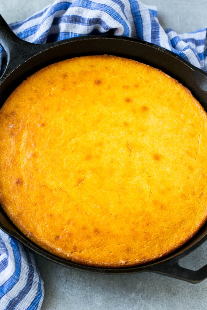 Honey Cornbread Recipe | Buttermilk Cornbread | Easy Cornbread | Homemade Cornbread | Cast Iron Cornbread #cornbread #honey #buttermilk #bread #sadud A cast iron pan of honey cornbread.