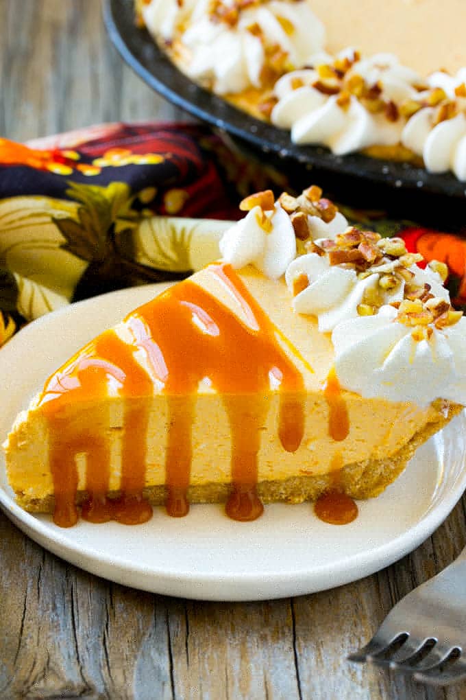 No Bake Pumpkin Cheesecake Recipe | Pumpkin Cheesecake | No Bake Cheesecake | Thanksgiving Dessert | Pumpkin Dessert #nobake #cheesecake #pumpkin #pumpkinpie #pumpkincheesecake #nobakecheesecake #dessert #sadud A piece of no bake pumpkin flavored cheesecake topped with caramel.