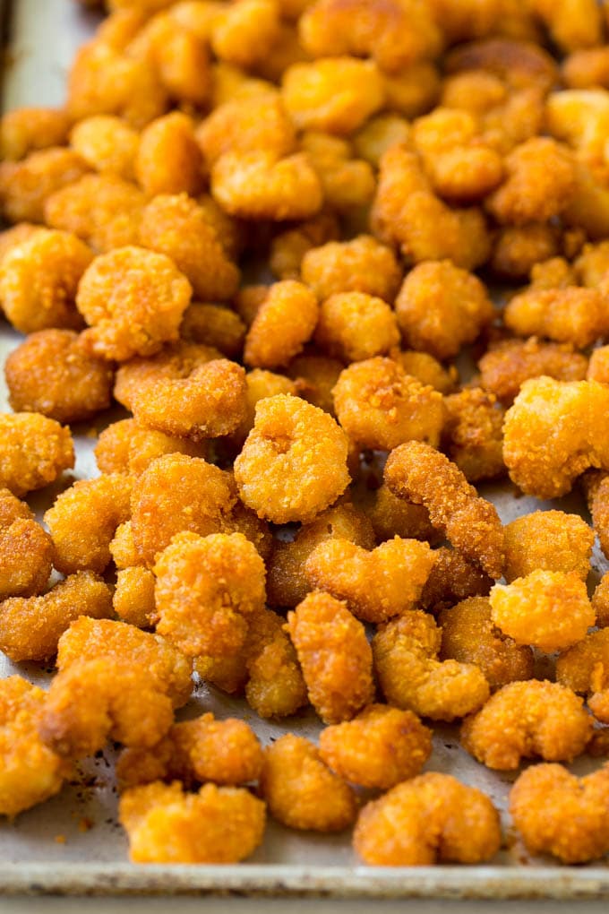 Sesame Shrimp Recipe | Crispy Shrimp | Popcorn Shrimp | Asian Shrimp | Easy Shrimp Recipe #shrimp #fried #friedshrimp #sesameshrimp #crispy #popcornshrimp #chinese #asian #dinner #sadud A pan of cooked popcorn shrimp.