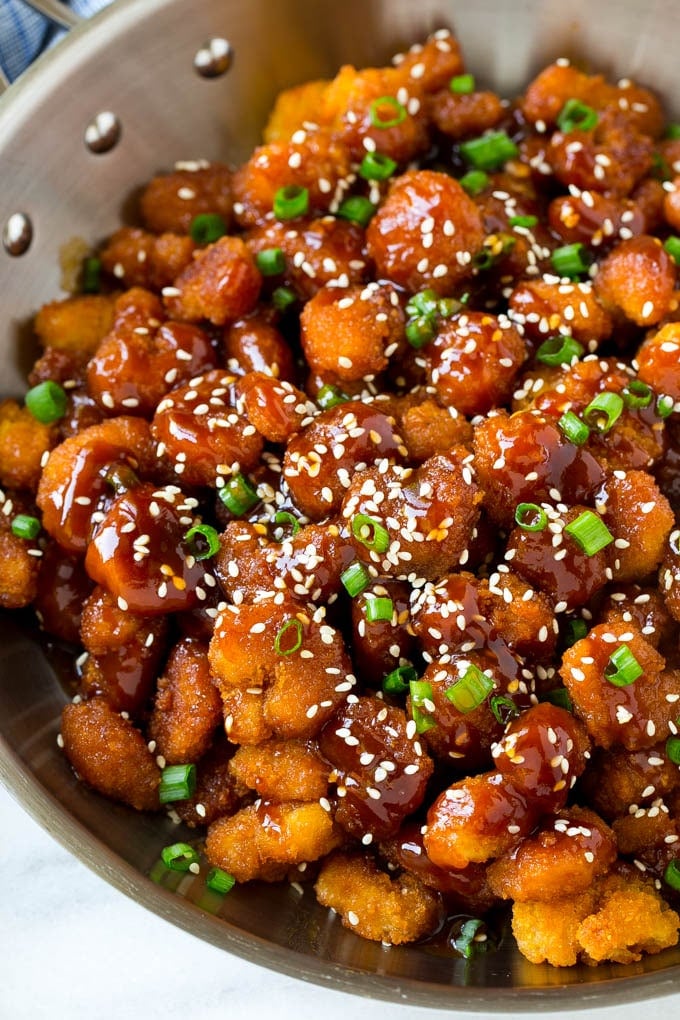 Sesame Shrimp Recipe | Crispy Shrimp | Popcorn Shrimp | Asian Shrimp | Easy Shrimp Recipe #shrimp #fried #friedshrimp #sesameshrimp #crispy #popcornshrimp #chinese #asian #dinner #sadud A pan of popcorn shrimp in an Asian sesame sauce.