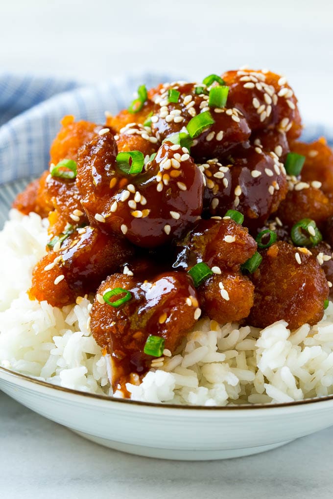 Sesame Shrimp Recipe | Crispy Shrimp | Popcorn Shrimp | Asian Shrimp | Easy Shrimp Recipe #shrimp #fried #friedshrimp #sesameshrimp #crispy #popcornshrimp #chinese #asian #dinner #sadud A bowl of Asian style crispy sesame shrimp over rice.