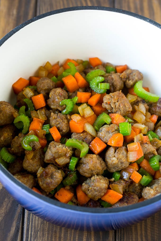 Tortellini Soup Recipe | Sausage Soup | Italian Soup #soup #sausage #pasta #tortellini #dinner #sadud Sausage, carrots, onion and celery in a pot.