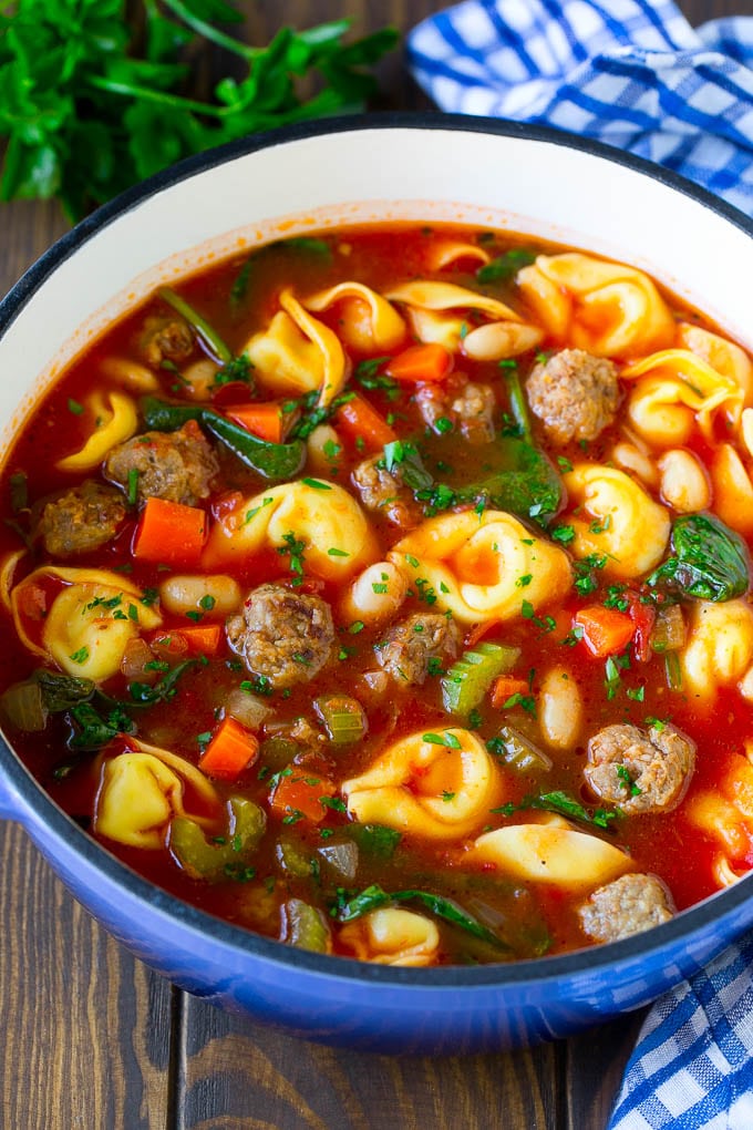 Tortellini Soup Recipe | Sausage Soup | Italian Soup #soup #sausage #pasta #tortellini #dinner #sadud A pot of tortellini soup with tomato broth, Italian sausage, spinach and carrots.