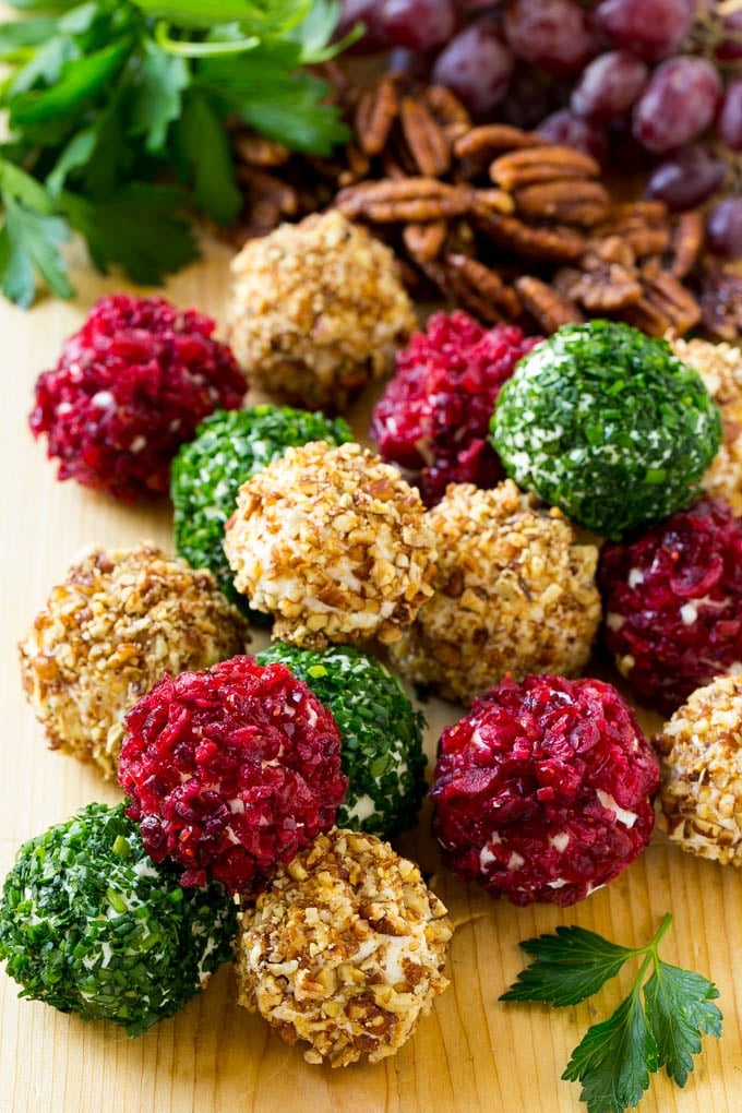 Cheese Ball Bites Recipe | Holiday Cheese Ball Recipe | Pecan Cheese Ball | Cranberry Cheese Ball | Mini Cheese Balls #cheeseball #cheese #appetizer #sadud Cheese ball bites rolled in assorted toppings and served with fruit and nuts.