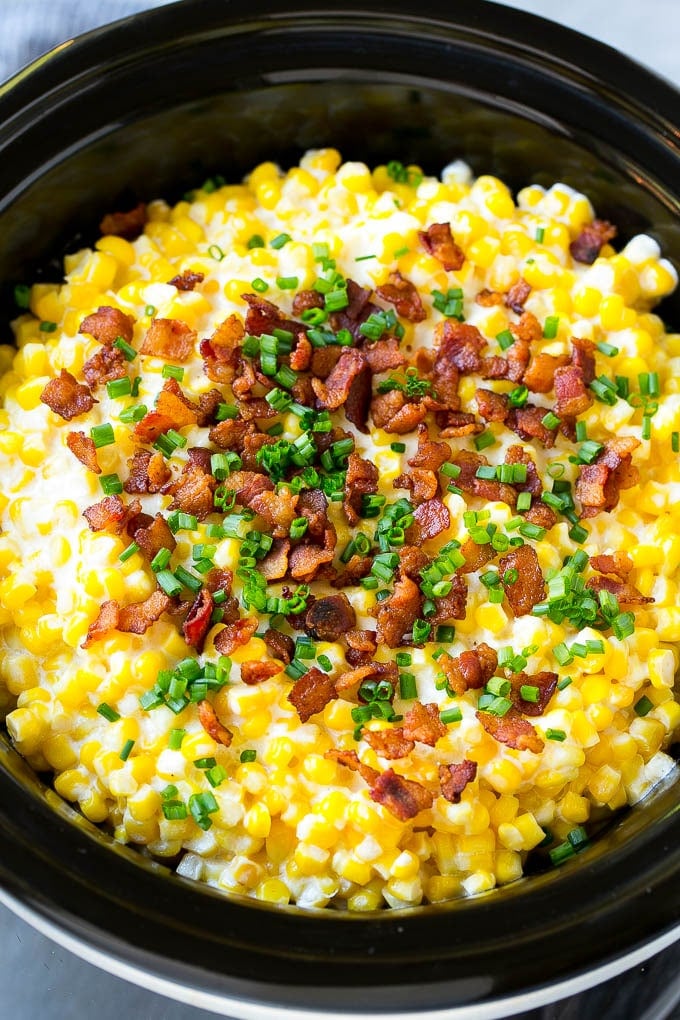 Slow Cooker Creamed Corn Recipe | Easy Creamed Corn Recipe | Slow Cooker Creamed Corn with Bacon | Southern Creamed Corn | Creamed Corn with Cream Cheese #creamedcorn #corn #bacon #crockpot #slowcooker #dinner #sadud Slow cooker creamed corn topped with bacon and chives.