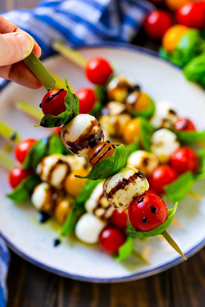 Caprese Skewers | Caprese Kabobs | Caprese Appetizer #tomato #mozzarella #basil #caprese #appetizer #sadud A kabob of mozzarella, tomatoes and basil drizzled with balsamic glaze.