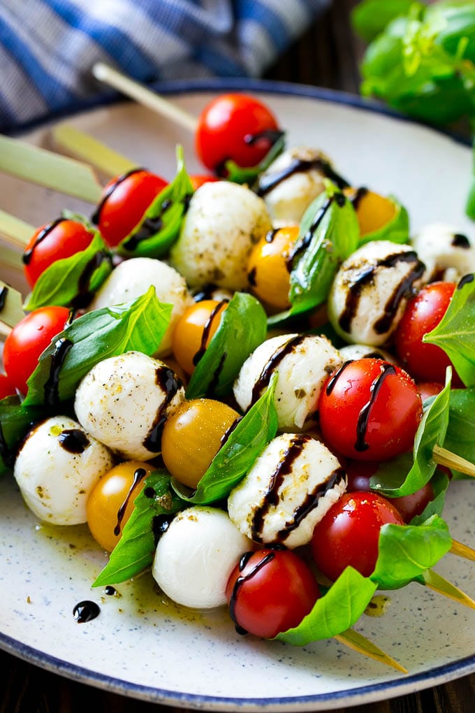 Caprese Skewers | Caprese Kabobs | Caprese Appetizer #tomato #mozzarella #basil #caprese #appetizer #sadud Caprese skewers with mozzarella, cherry tomatoes and basil with balsamic glaze.