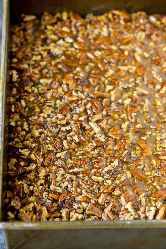 Pecan Pie Bars Recipe #pecans #pie #fall #pecanpie #dessert #thanksgiving #sadud Pecans and brown sugar poured over a cookie crust.