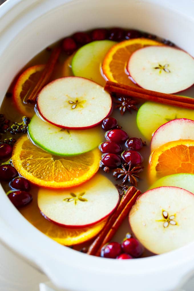 Slow Cooker Apple Cider | Mulled Apple Cider | Crockpot Apple Cider #cider #apple #applecider #drink #crockpot #slowcooker #sadud Slow cooker apple cider with oranges, apple slices, cinnamon sticks and cranberries.