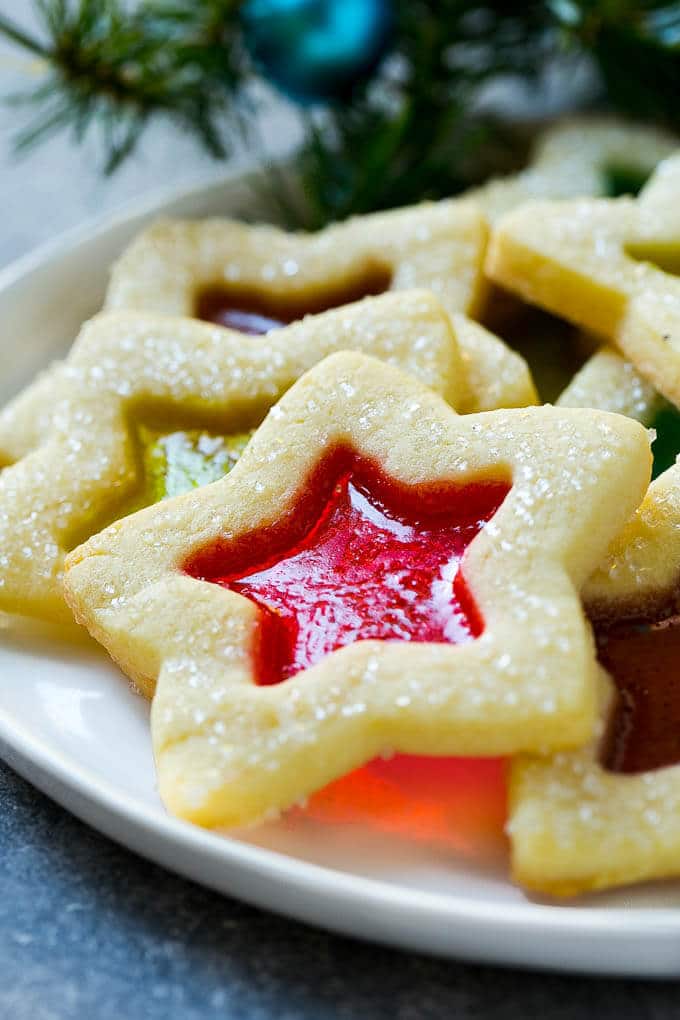 Stained Glass Cookies | Stained Glass Window Cookies | Christmas Cookies | Sugar Cookies | Holiday Cookies #cookies #stainedglasscookies #sugarcookies #christmascookies #christmas #holiday #dessert #sadud A star shaped cookie on a serving plate.