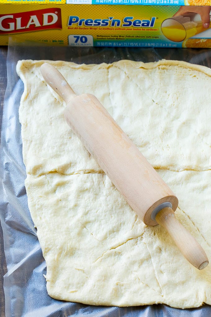 Veggie Pizza Recipe | Crescent Veggie Pizza | Vegetable Pizza Recipe | Holiday Appetizer | Homemade Veggie Pizza #pizza #veggies #vegetarian #appetizer #sadud Crescent roll dough rolled out into a rectangle.