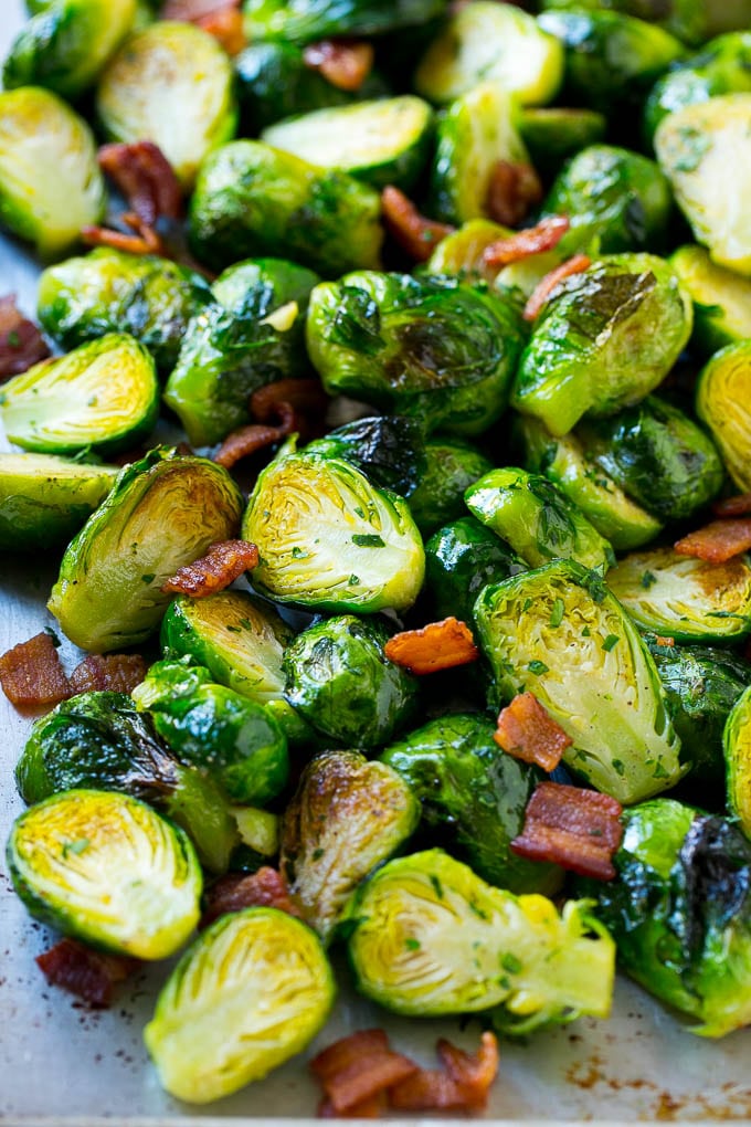 These bacon roasted brussels sprouts are crispy on the outside, soft on the inside and full of smoky flavor. A sheet pan of oven roasted brussels sprouts and bacon.