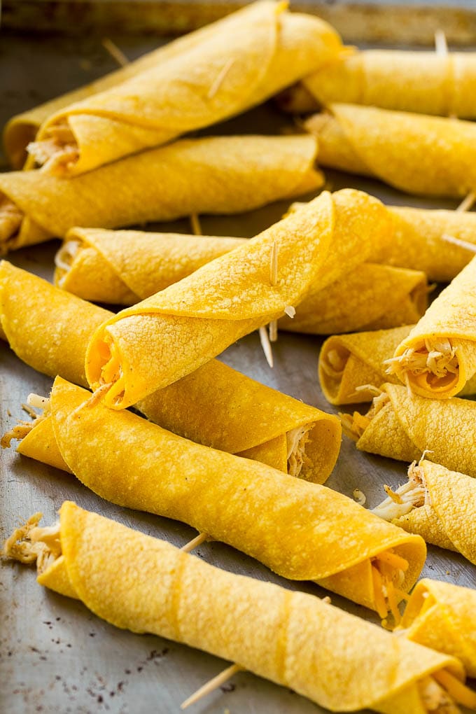 Chicken Taquitos Recipe | Baked Chicken Taquitos | Fried Chicken Taquitos | Mexican Appetizer | Chicken Tortillas #taquitos #chicken #appetizer #tortillas #mexicanfood #sadud Rolled up chicken taquitos ready for the fryer or oven.