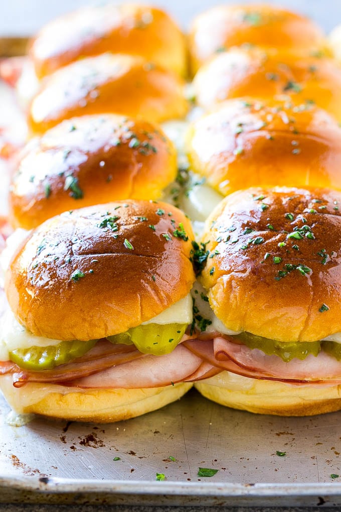 Cuban Sliders Recipe | Cuban Sandwich Recipe | Slider Sandwiches | Ham and Cheese Sliders #sliders #sandwiches #ham #cheese #appetizer #sadud A sheet pan of Cuban slider sandwiches.