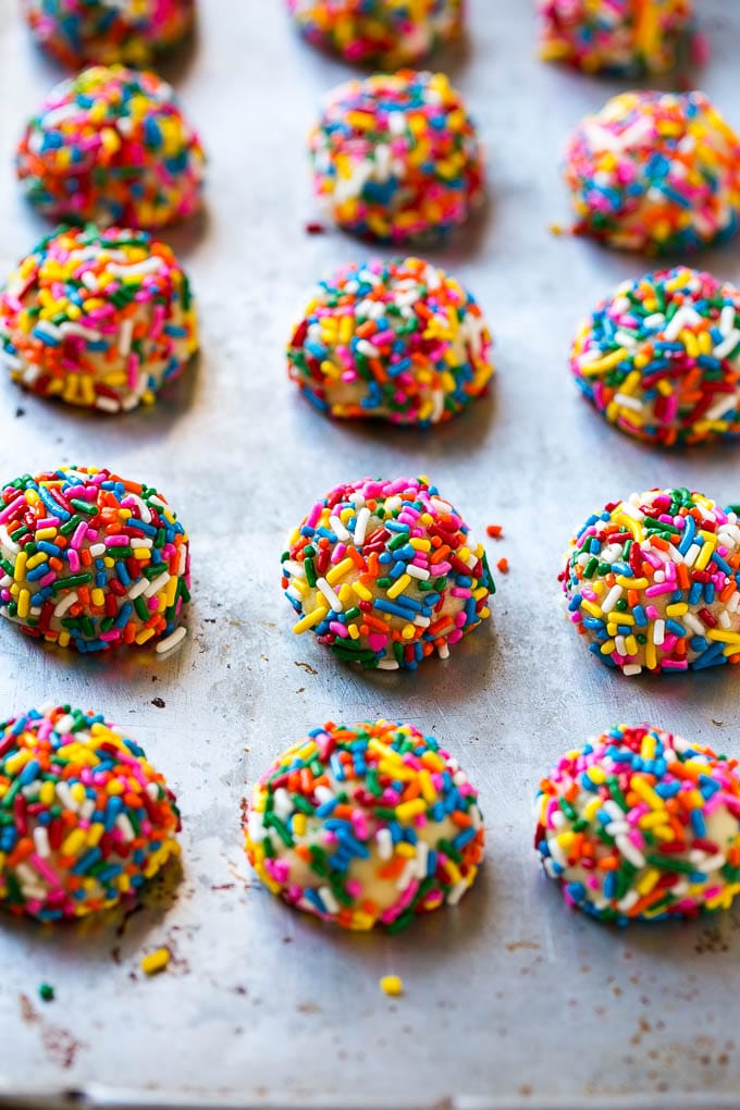 Funfetti Cookies Recipe | Funfetti Cake Mix Cookies | Sprinkle Cookies | Cake Mix Cookies #cookies #funfetti #sprinkles #dessert #sadud Balls of cookie dough coated in sprinkles.