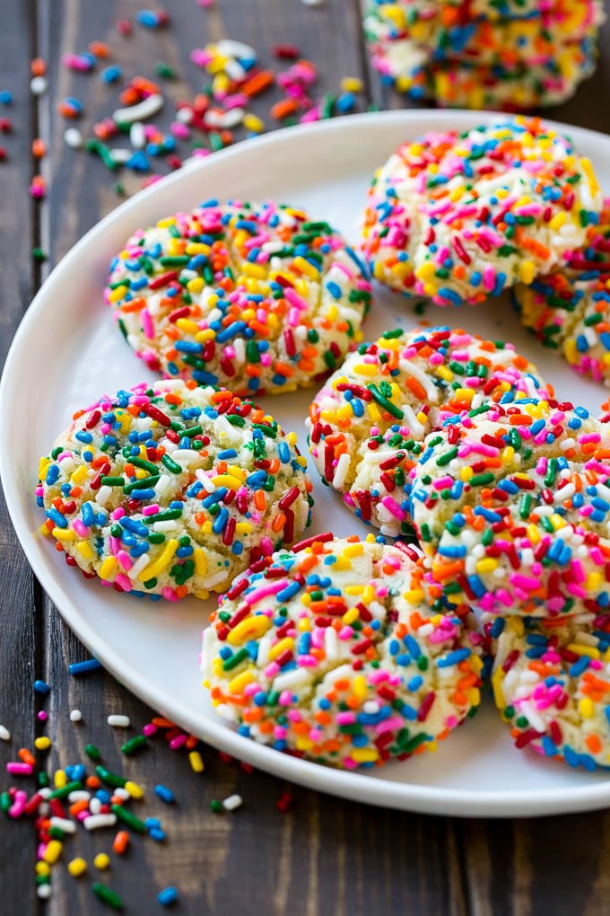 Funfetti Cookies Recipe | Funfetti Cake Mix Cookies | Sprinkle Cookies | Cake Mix Cookies #cookies #funfetti #sprinkles #dessert #sadud A plate of funfetti cookies coverd in rainbow sprinkles.