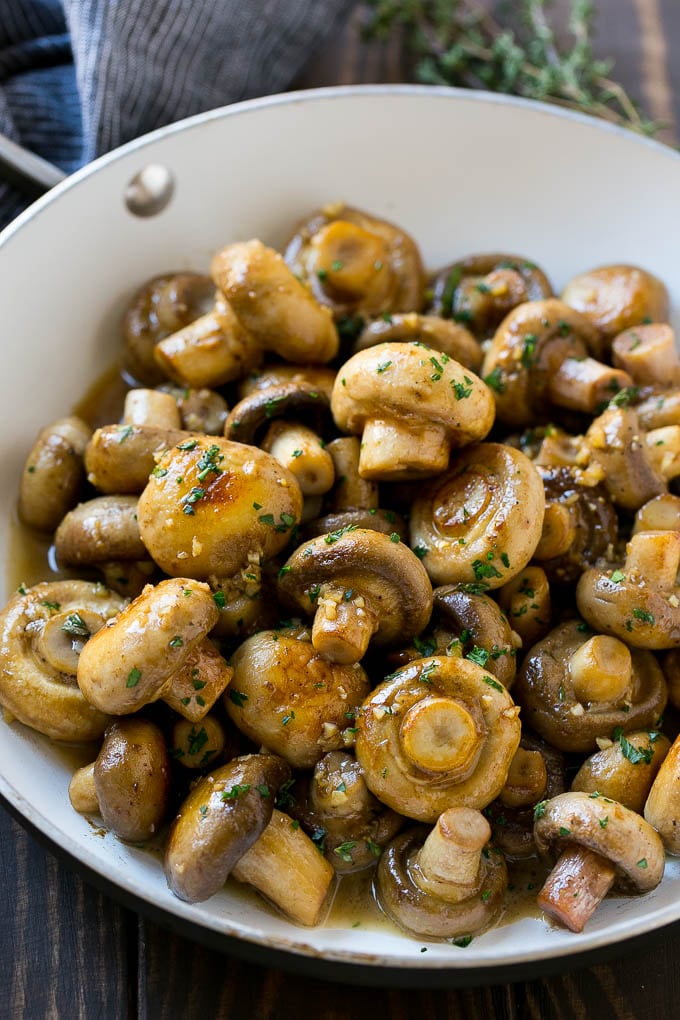Garlic Mushrooms Recipe | Steakhouse Mushrooms | Sauteed Mushrooms | Garlic Butter Mushrooms | Mushroom Side Dish #mushrooms #butter #keto #lowcarb #dinner #sidedish #sadud A pan full of cooked mushrooms coated in garlic butter.