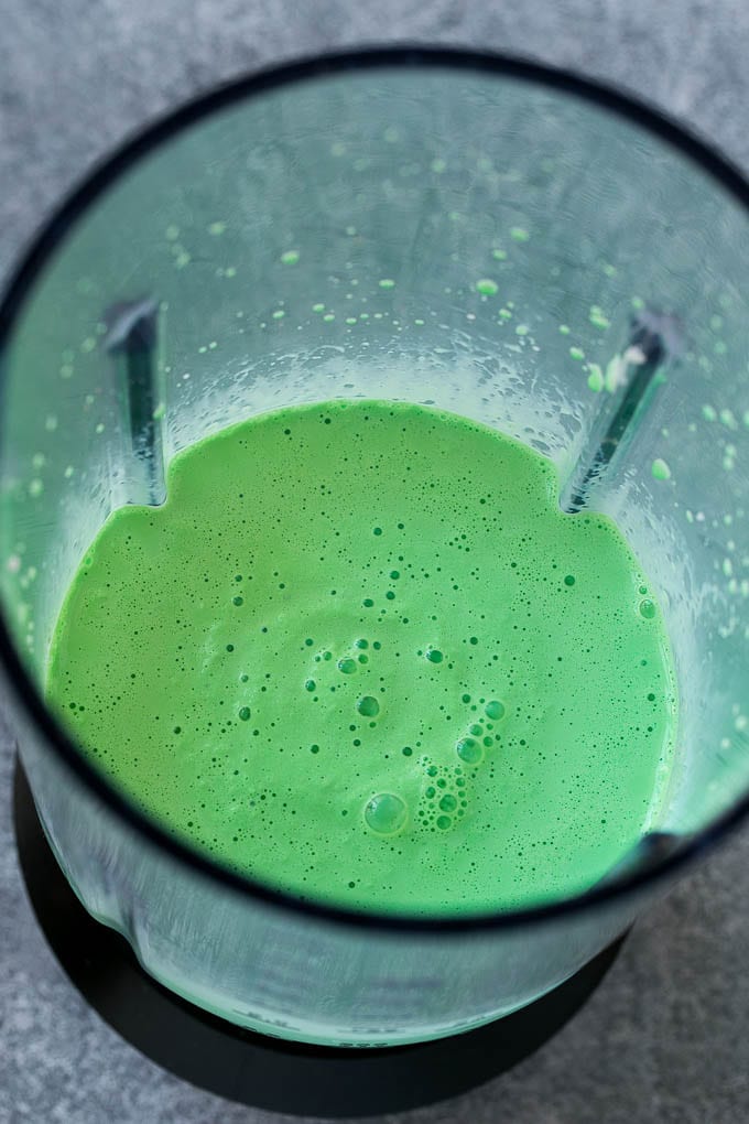 Shamrock Shake Recipe | McDonald's Shamrock Shake | Saint Patrick's Day Drink | Mint Milkshake #milkshake #stpatricksday #saintpatricksday #mint #sadud Green milkshake in a blender.
