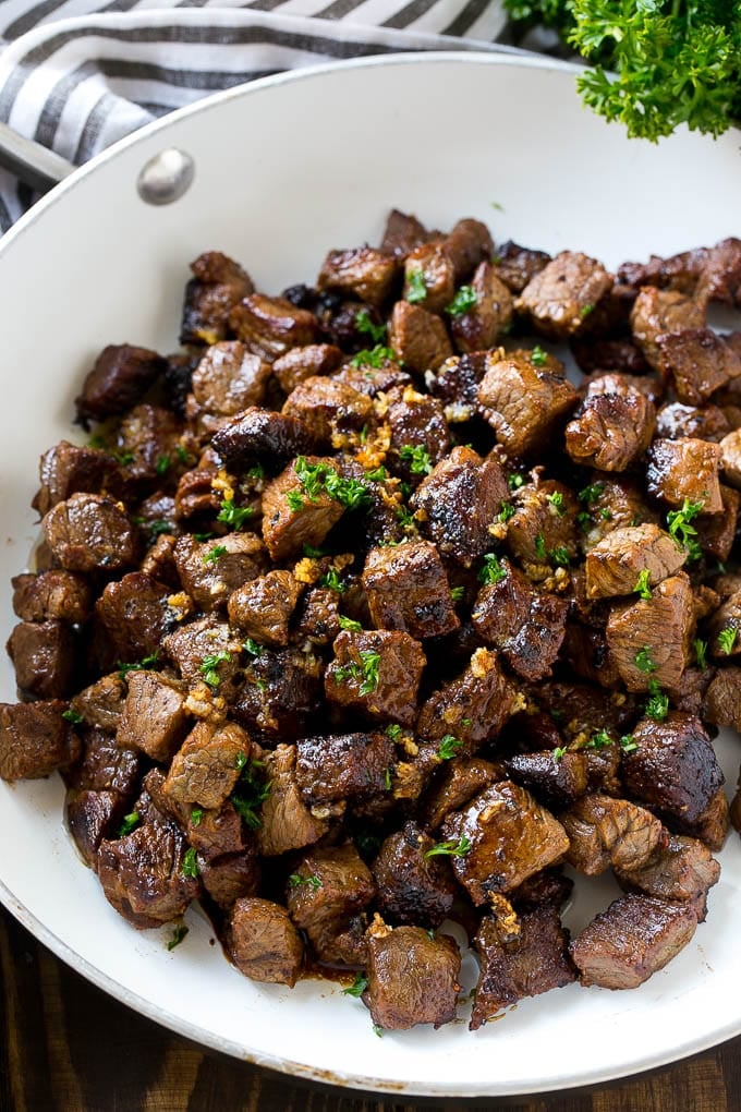 Steak Bites in Garlic Butter Recipe | Garlic Steak | Sirloin Steak Recipe | Steak Appetizer #steak #lowcarb #keto #sadud #dinner A frying pan of beef cubes tossed in garlic butter.