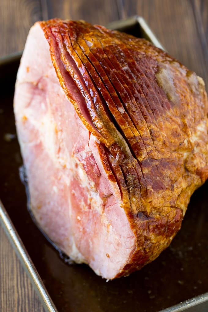 Coca Cola Ham | Coke Glazed Ham | Easter Ham | Christmas Ham | Holiday Ham Recipe #ham #easter #christmas #dinner #sadud An uncooked spiral ham topped with coke and brown sugar.