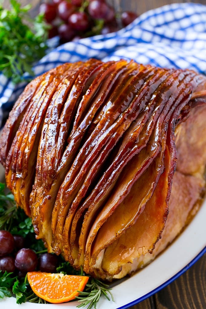 Coca Cola Ham | Coke Glazed Ham | Easter Ham | Christmas Ham | Holiday Ham Recipe #ham #easter #christmas #dinner #sadud A whole spiral cut coca cola ham on a platter.