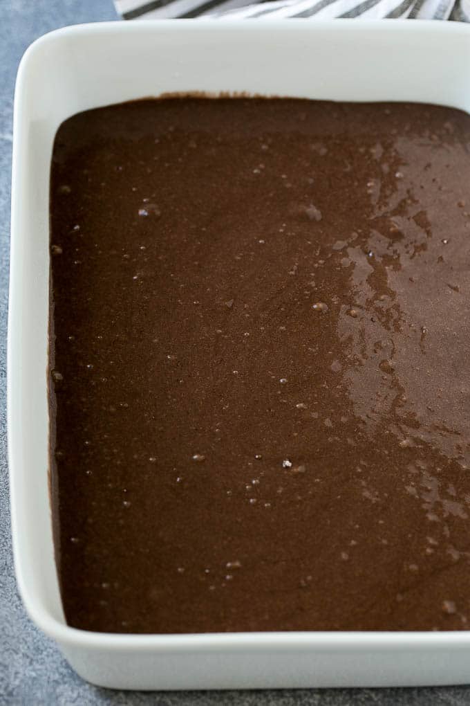 Earthquake Cake Recipe | Chocolate Cake Recipe | Chocolate Coconut Cake | Coconut Pecan Cake #cake #chocolate #coconut #pecans #dessert #chocolatecake #sadud Chocolate cake batter in a baking dish.