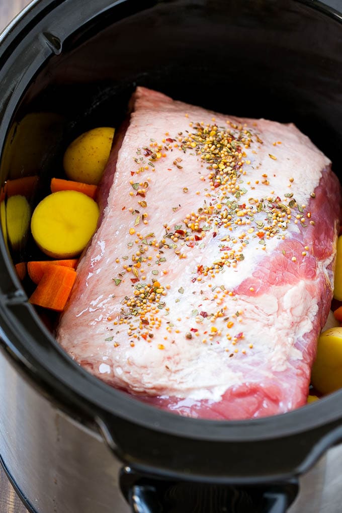 Slow Cooker Corned Beef Recipe | Crock Pot Corned Beef | Corned Beef and Cabbage #beef #cornedbeef #cabbage #potatoes #carrots #stpatricksday #irish #sadud A corned beef roast in a slow cooker with carrots and potatoes.