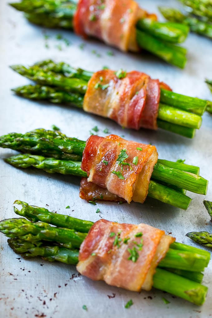Bacon Wrapped Asparagus Recipe | Roasted Asparagus | Asparagus Side Dish #asparagus #bacon #sidedish #dinner #sadud Roasted asparagus in bundles on a sheet pan.