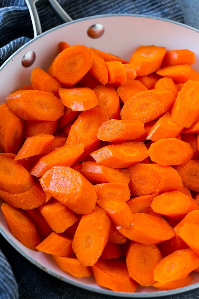 Candied Carrots Recipe | Carrot Side Dish | Brown Sugar Carrots | Glazed Carrots #carrots #brownsugar #sidedish #dinner #sadud Raw sliced carrots in a pan.