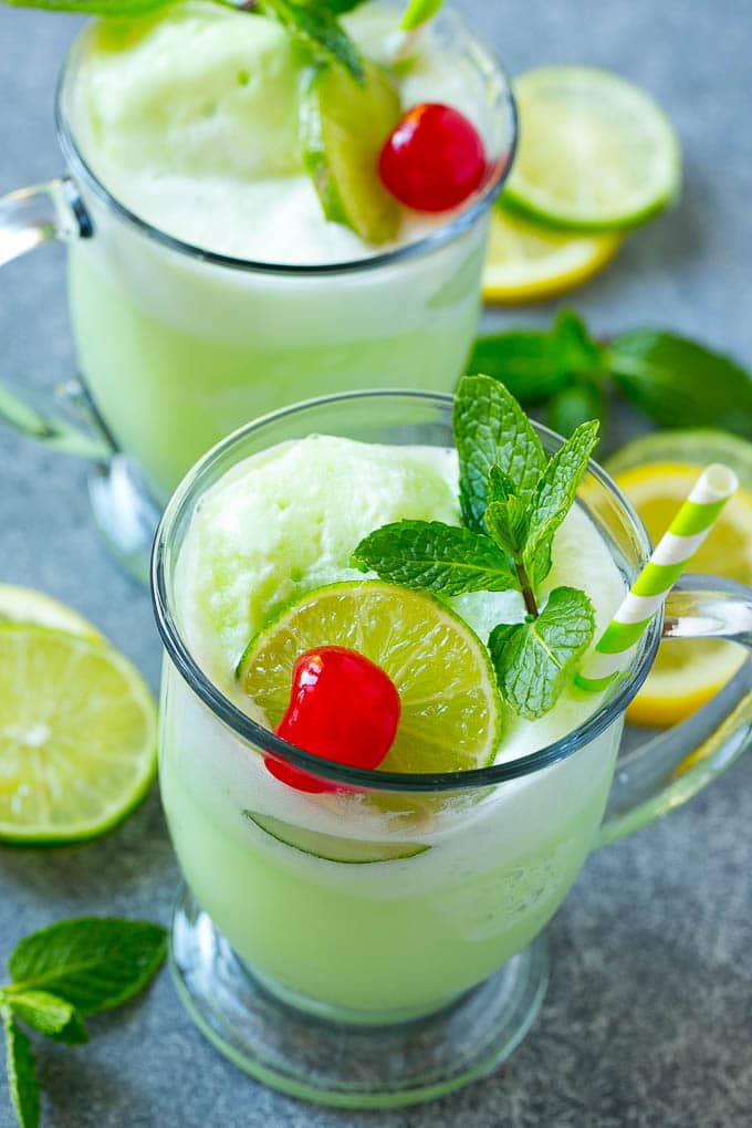 Lime Sherbet Punch | Party Punch Recipe | Sherbet Punch Recipe | Limeade Recipe #sherbet #punch #lime #drink #sadud Cups of sherbet punch with straws.