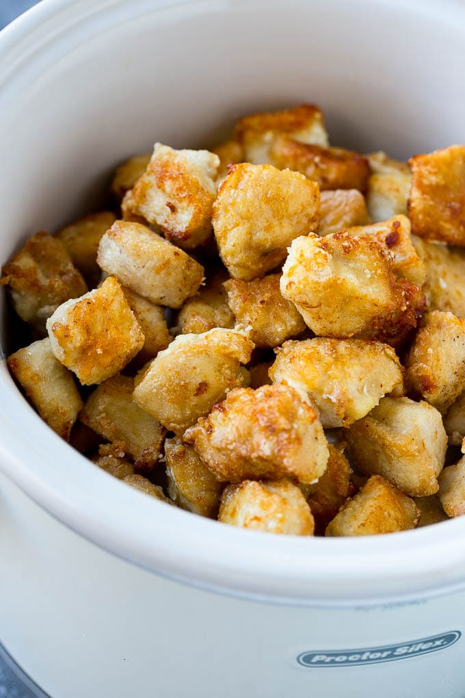 Breaded chicken in a slow cooker is the basis of orange chicken.