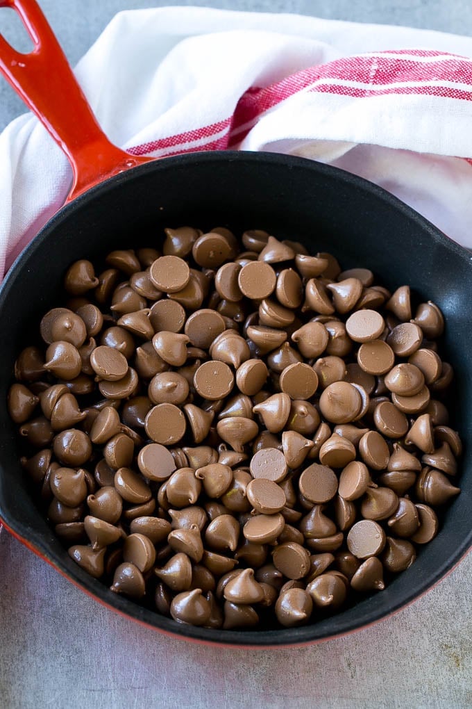 S'mores Dip Recipe | S'mores Skillet | Baked S'mores #smores #dip #chocolate #marshmallow #dessert #sadud A skillet of milk chocolate chips.