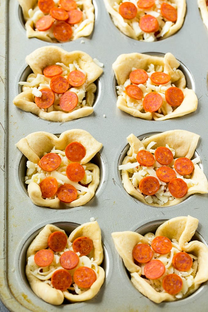 Pizza Muffins Recipe | Pizza Bites | Pizza Cups | Pizza Appetizer #pizza #appetizer #sadud Unbaked dough cups filled with cheese, sauce and pepperoni.
