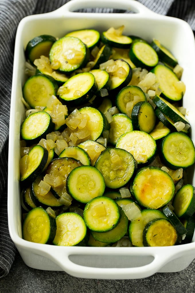 Zucchini Gratin Recipe | Cheesy Zucchini | Baked Zucchini | Easy Zucchini Recipe #zucchini #casserole #cheese #dinner #sidedish #sadud Sauteed zucchini and onions in a baking dish.