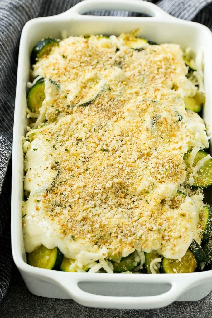 Zucchini Gratin Recipe | Cheesy Zucchini | Baked Zucchini | Easy Zucchini Recipe #zucchini #casserole #cheese #dinner #sidedish #sadud Zucchini gratin with layers of cheese, sauce and breadcrumbs, ready to go into the oven.