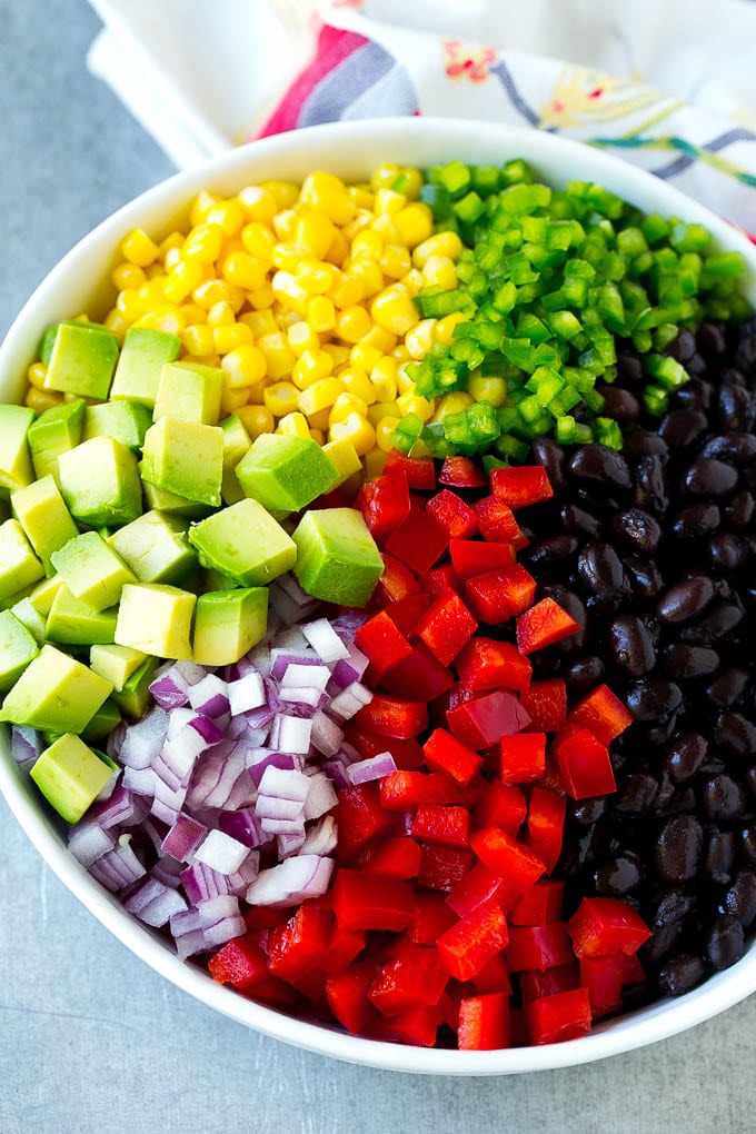 Black Bean and Corn Salad Recipe | Mexican Salad | Black Bean Salad | Bean Salad #salad #beans #corn #mexicanfood #sadud A bowl of beans, corn, diced red peppers, minced jalapeno, red onion and avocado.