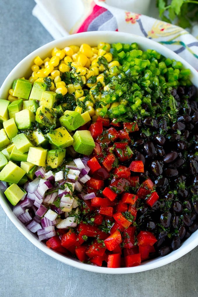 Black Bean and Corn Salad Recipe | Mexican Salad | Black Bean Salad | Bean Salad #salad #beans #corn #mexicanfood #sadud Black beans, corn and assorted vegetables topped with cilantro lime dressing.