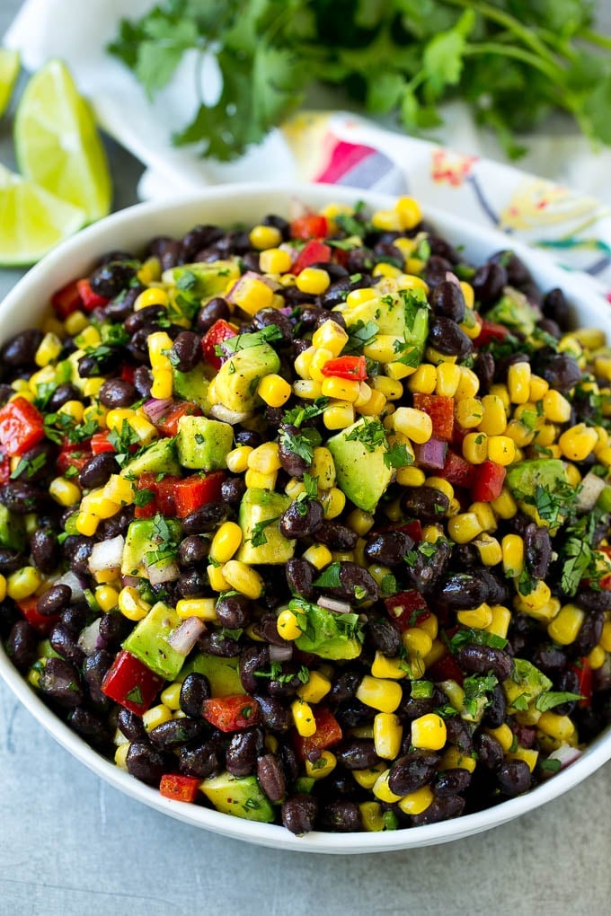 Black Bean and Corn Salad Recipe | Mexican Salad | Black Bean Salad | Bean Salad #salad #beans #corn #mexicanfood #sadud A serving bowl of black bean salad with corn, peppers and avocado.