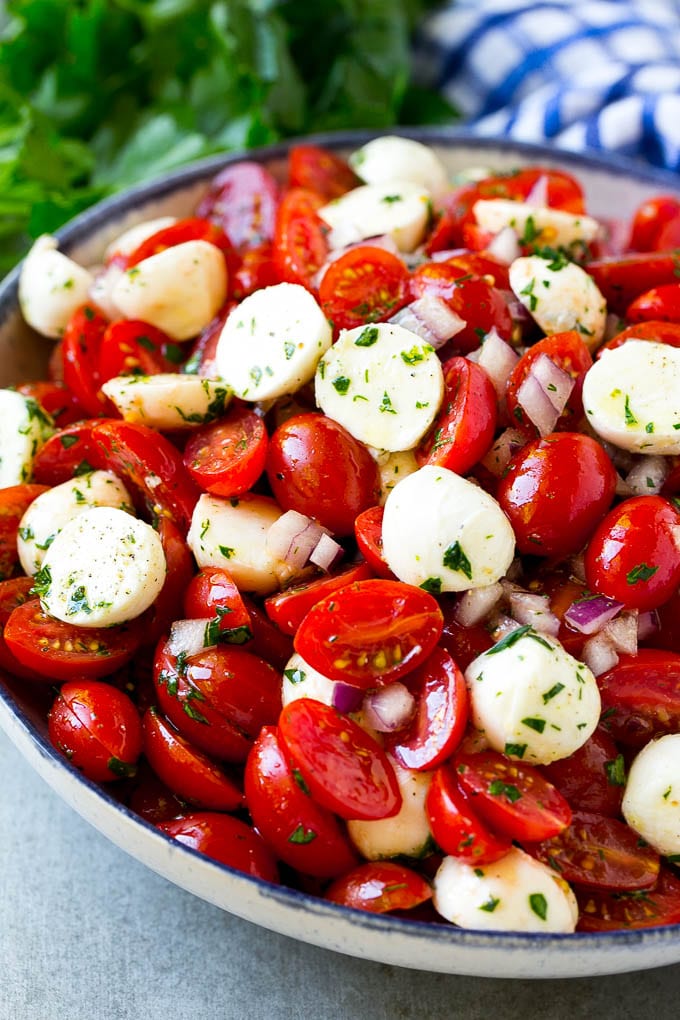 Cherry Tomato Salad Recipe | Tomato Mozzarella Salad | Caprese Salad | Tomato Salad #tomatoes #salad #tomatosalad #caprese #sadud Cherry tomato salad with halved cherry tomatoes, mozzarella balls and red onion, all tossed with herbs and dressing.