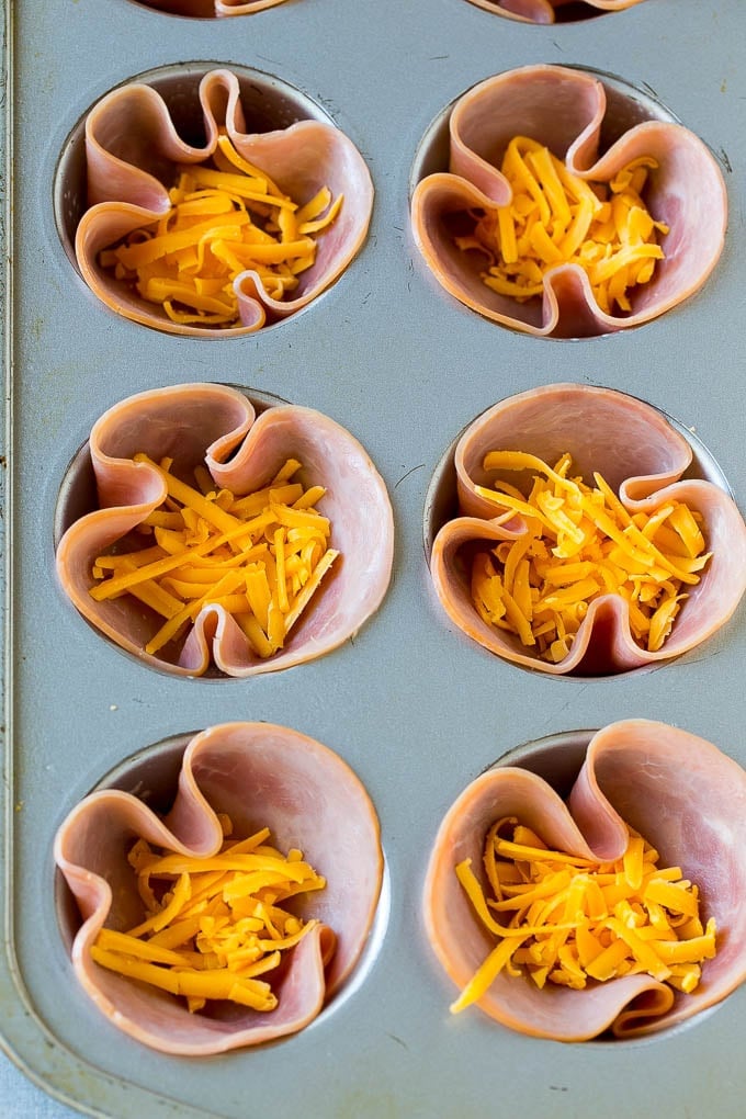 Ham and Egg Cups Recipe | Low Carb Breakfast | Ham and Eggs #ham #eggs #lowcarb #breakfast #sadud Ham pressed into muffin tins and topped with shredded cheese.