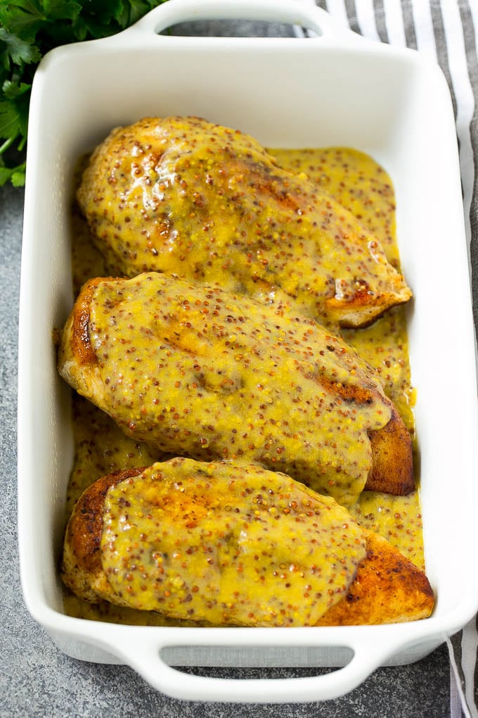 Honey Mustard Chicken Recipe | Baked Chicken Recipe | Easy Chicken Recipe #chicken #dinner #sadud Chicken breasts in a baking dish topped with sauce.