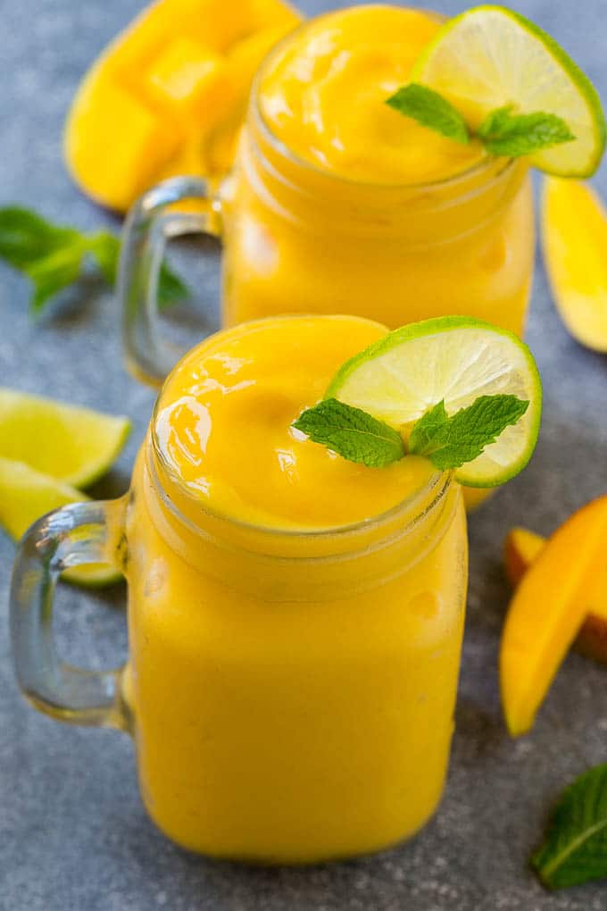 Mango Smoothie Recipe | Mango Recipe | Healthy Smoothie #mango #smoothie #drink #sadud Mango smoothie in a mason jar mug.