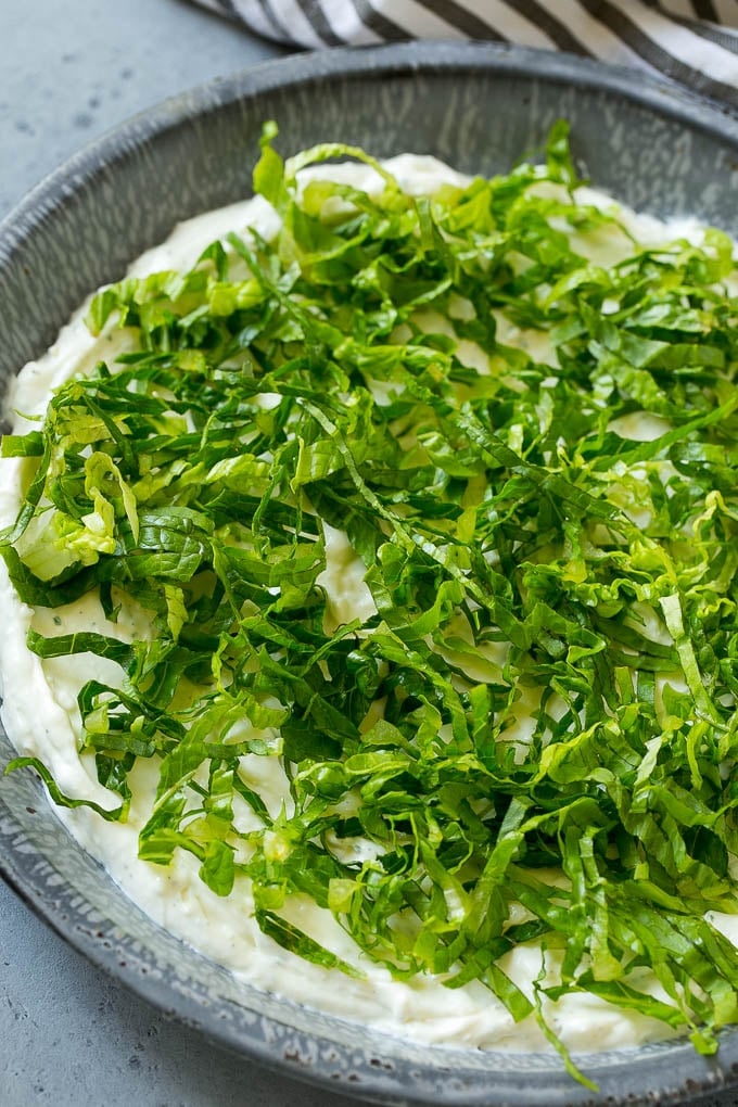 BLT Dip Recipe | Bacon Dip Recipe | Ranch Dip #dip #ranch #bacon #lettuce #tomato #appetizer #sadud Shredded romaine lettuce over a sour cream, cream cheese and ranch powder base.