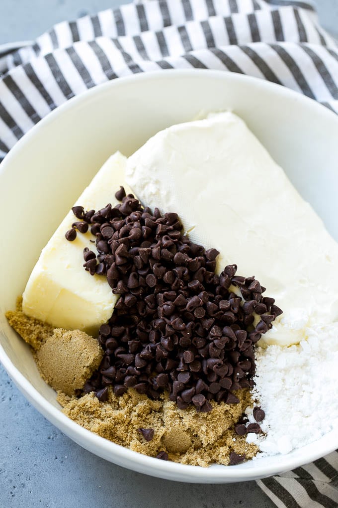 Cookie Dough Dip Recipe | Edible Cookie Dough | Chocolate Chip Cookie Dip #cookies #dip #cookiedough #dessert #snack #sadud Ingredients including butter, cream cheese, chocolate chips and brown sugar.