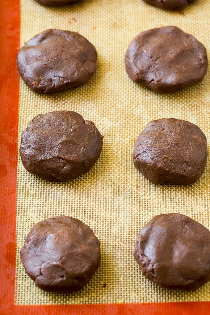 Nutella Cookies Recipe | Nutella Stuffed Cookies | Chocolate Cookies #nutella #chocolate #cookies #baking #dessert #sadud Nutella cookie dough on a baking sheet.