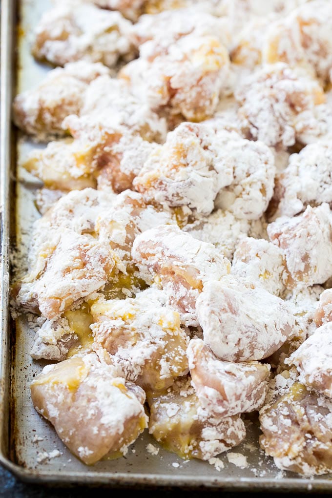 Orange Chicken Recipe | Chinese Orange Chicken | Panda Express Orange Chicken #orange #chicken #takeout #chinesefood #dinner #sadud Chicken pieces coated in egg and flour.