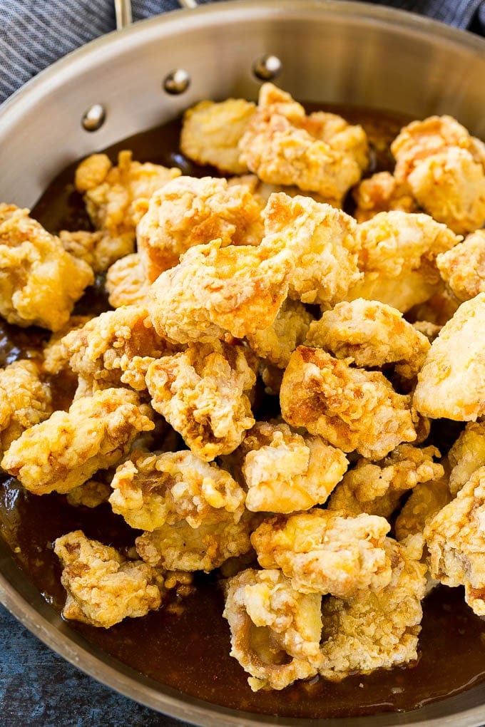 Orange Chicken Recipe | Chinese Orange Chicken | Panda Express Orange Chicken #orange #chicken #takeout #chinesefood #dinner #sadud Crispy chicken pieces in a pan of orange sauce.