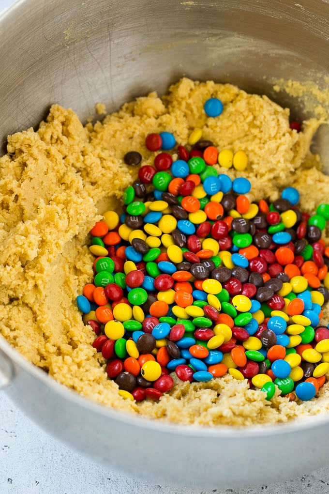 Oreo Stuffed Cookies Recipe | M&M's cookies | Stuffed Cookies #cookies #chocolate #oreos #dessert #baking #sadud Cookie dough in a mixing bowl with miniature M&M's in it.