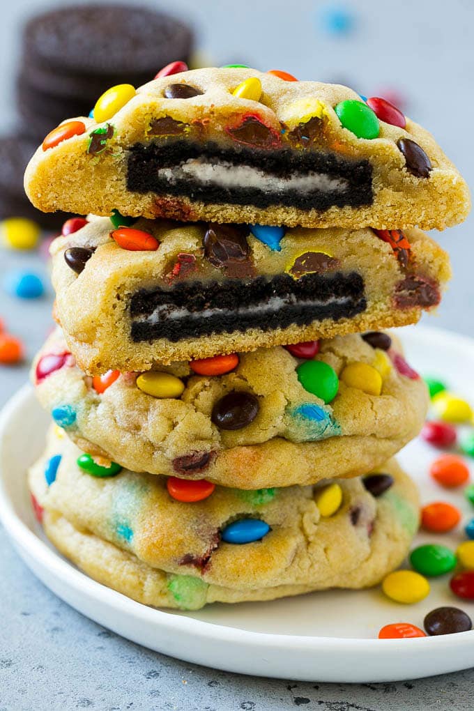 Oreo Stuffed Cookies Recipe | M&M's cookies | Stuffed Cookies #cookies #chocolate #oreos #dessert #baking #sadud A stack of Oreo stuffed cookies on a plate.