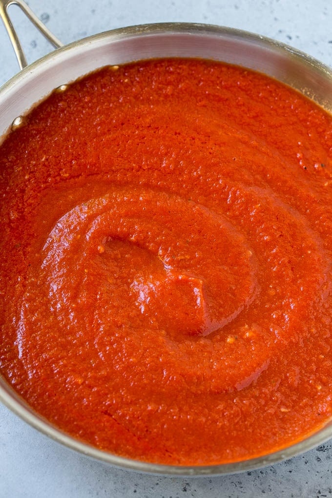 This Penne alla Vodka is tender penne pasta tossed in a rich and delicious tomato, vodka and cream sauce. Add a sprinkling of parmesan cheese and you'll have a restaurant quality meal in the comfort of your own home. Tomato puree, butter and garlic in a skillet.